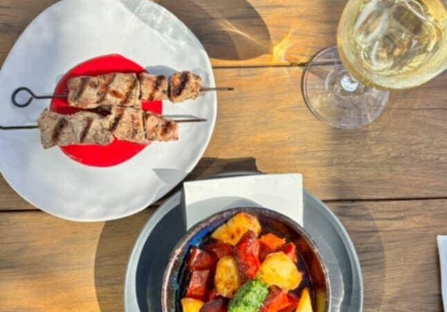 Lamb & chorizo entrees with wine